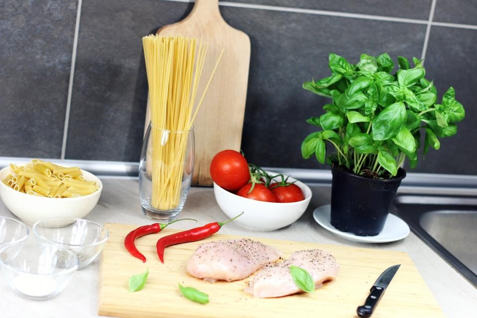 Fresh ingredients and chicken breast ready to cook