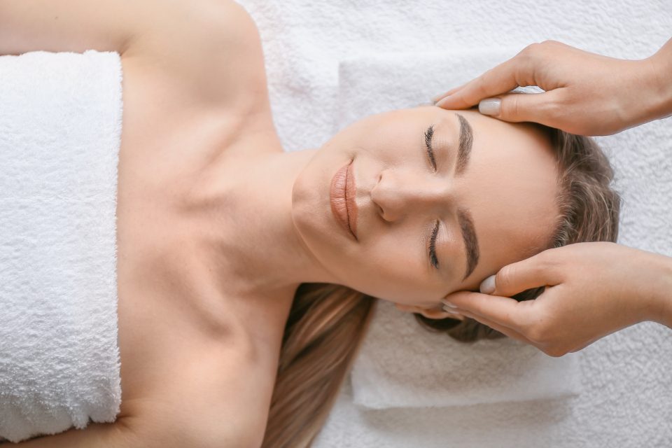 Woman relaxing during a head massage
