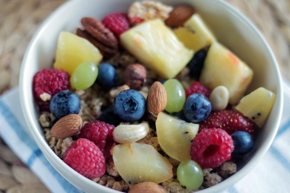 Bowl of granola with fresh berries and fruit